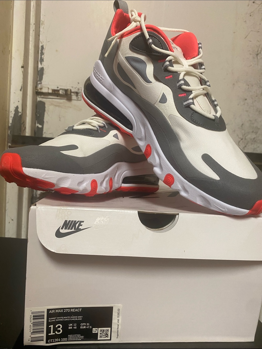 Nike Air Max 270 React in White, Gray, and Red-Orange